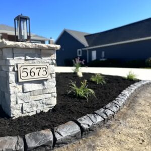 A masterful concrete curbing job done around a client's mailbox.