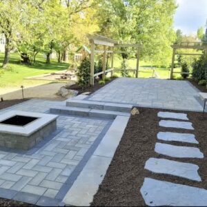 A wonderful outside living area with a firepit and new mulch.