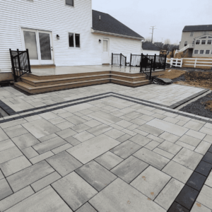 A beautiful paver patio that is freshly installed ready for furniture.