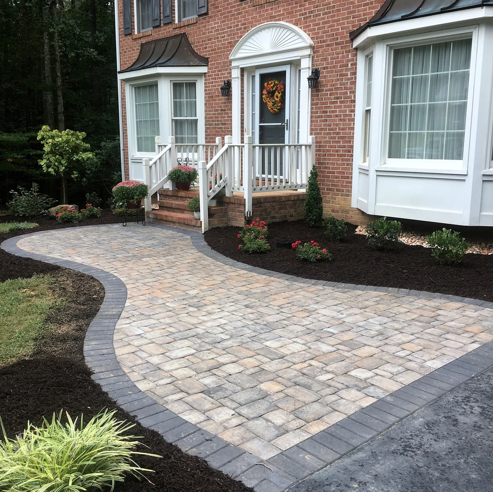 Curbscapes Outdoors masonry auburn in 2 - Curbscapes Outdoors Front entry pavers walkway with dark border leading to brick steps and freshly mulched planting beds.